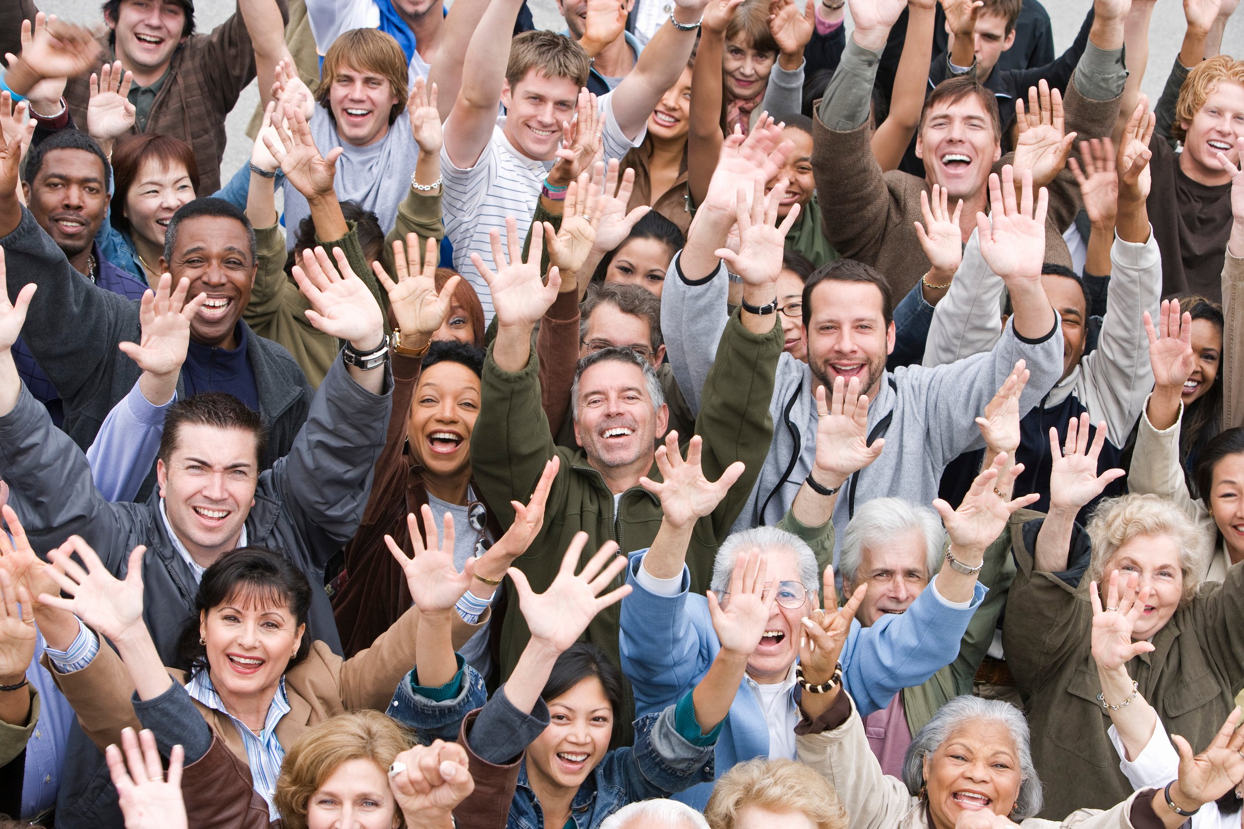 Crowd with arms raised